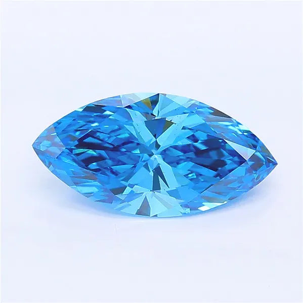 Marquise cut vivid blue lab grown diamond with brilliant faceting on a white background.