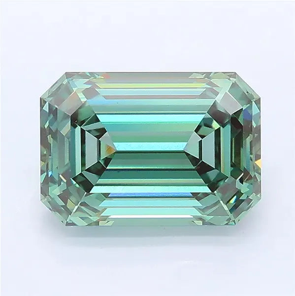 Emerald cut vivid green lab grown diamond with step-cut facets and teal-green reflections.