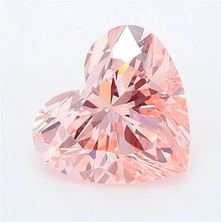 Heart cut intense pink lab grown diamond with brilliant facets and IGI certification.