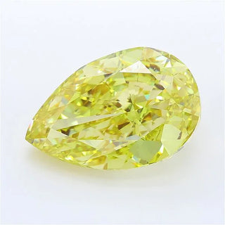 Pear cut intense yellow lab grown diamond with brilliant faceting on a white background.