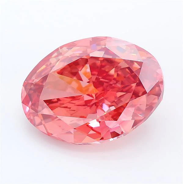 Oval cut vivid pink lab grown diamond with brilliant facets on a white background.