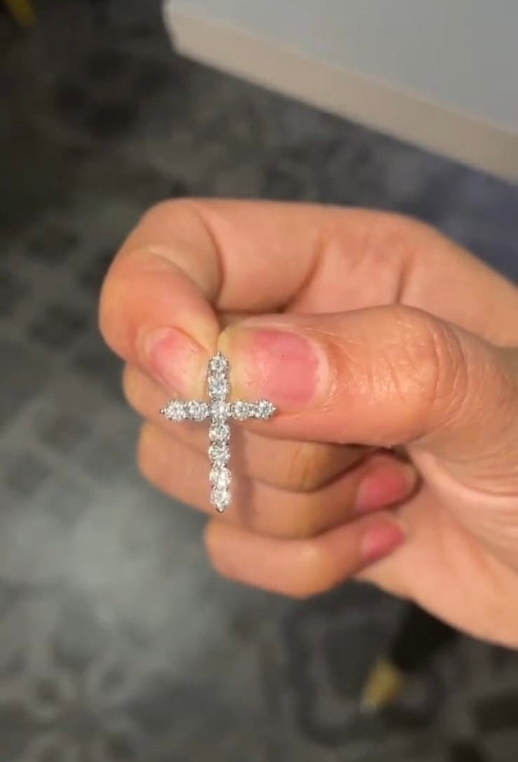 Customer holding a lab grown diamond cross pendant from Driona Jewels