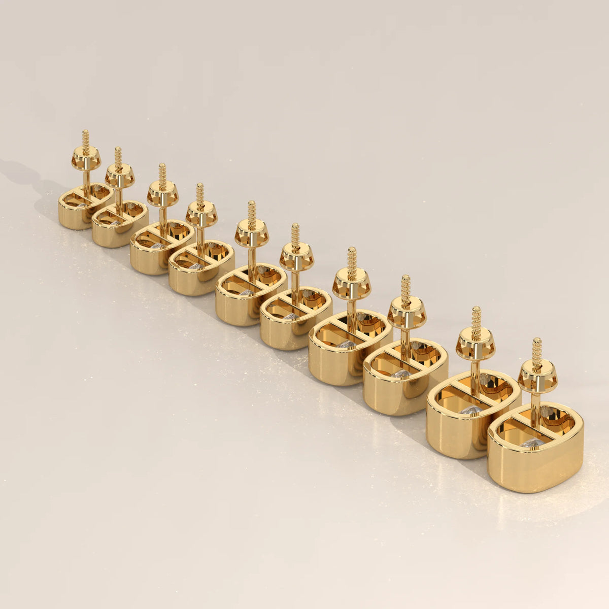 A set of 10 gold stud earrings, each with a small diamond, arranged diagonally.