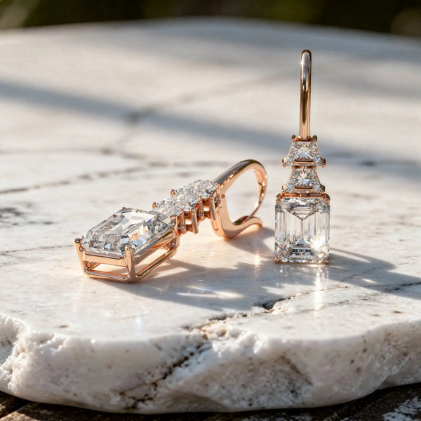 Flat Lay: Emerald Cut Diamond Earrings with Leverback Setting in 14k Rose Gold - Lab Grown - Driona Jewels