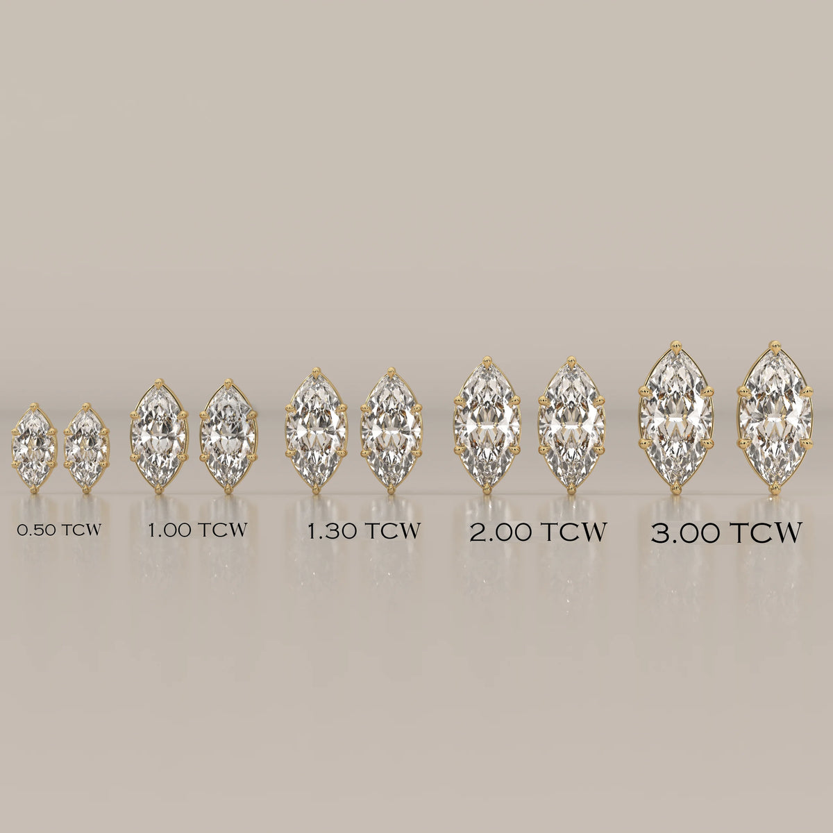 Collection of marquise-cut diamond stud earrings in yellow gold, showing various sizes.