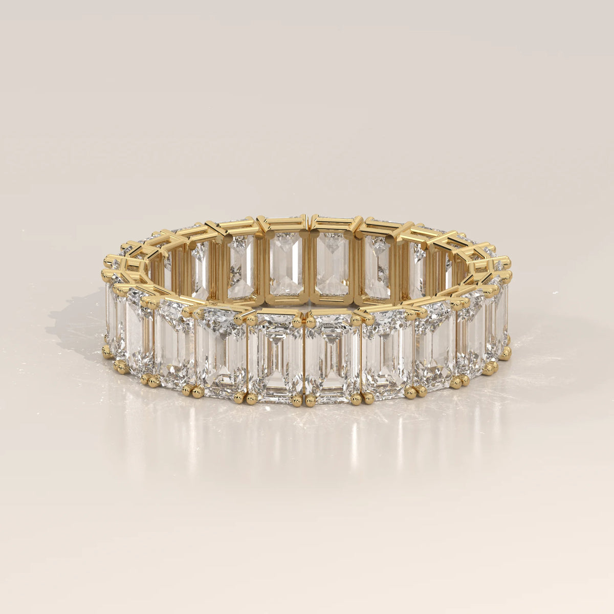 East West Emerald Cut Diamond Eternity Band in Solid Gold in yellow gold, shown from the front.