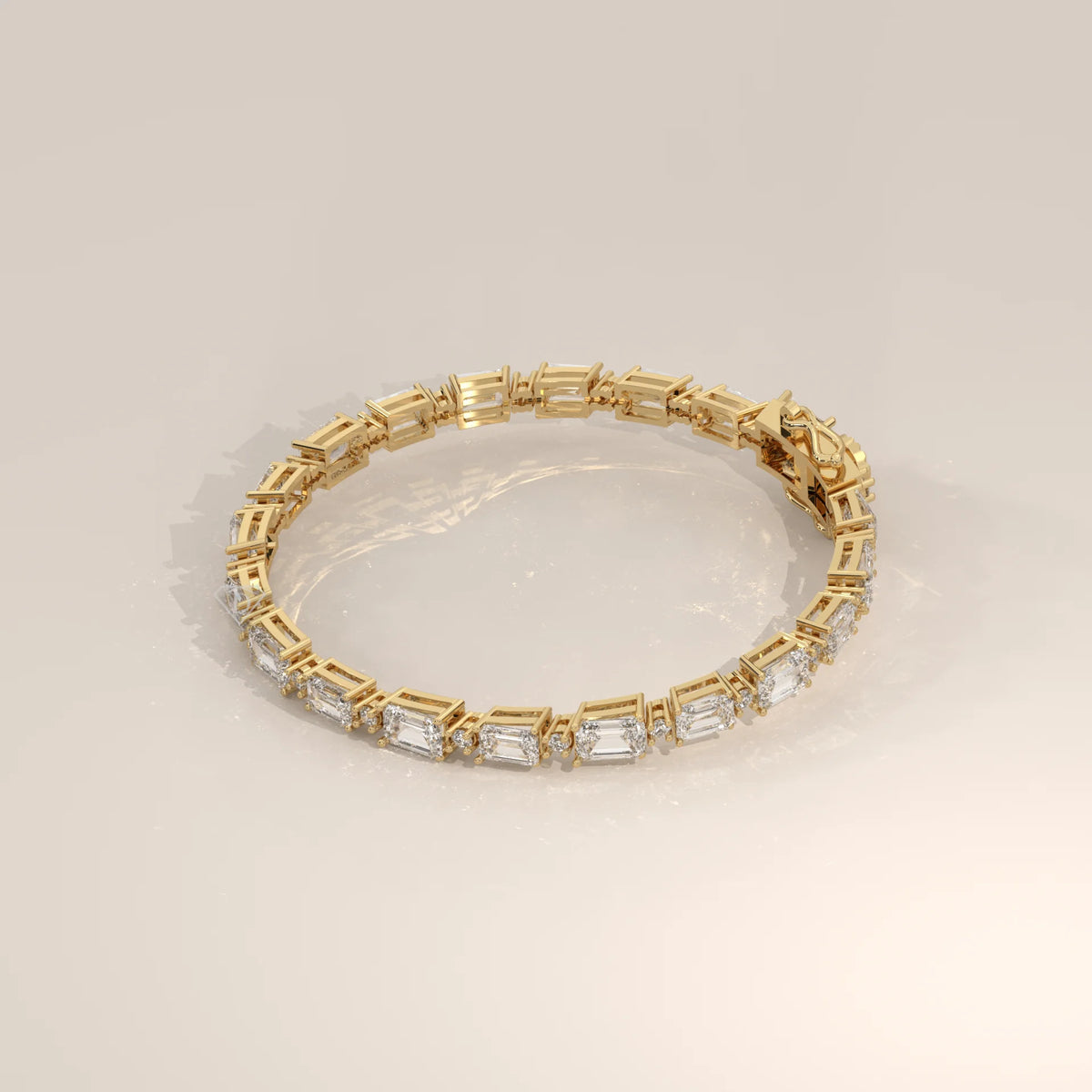 East West Emerald Cut Lab Grown Diamond Bracelet with Round Accents in yellow gold, shown at an angle.