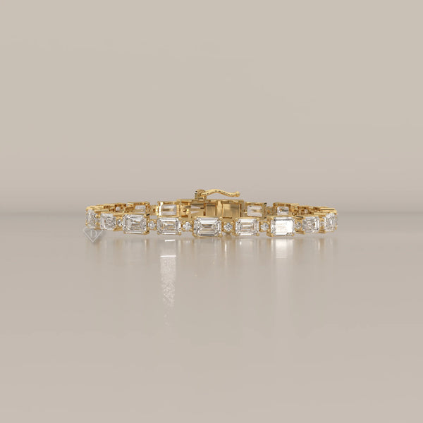 East West Emerald Cut Lab Grown Diamond Bracelet with Round Accents in yellow gold, shown from the front.