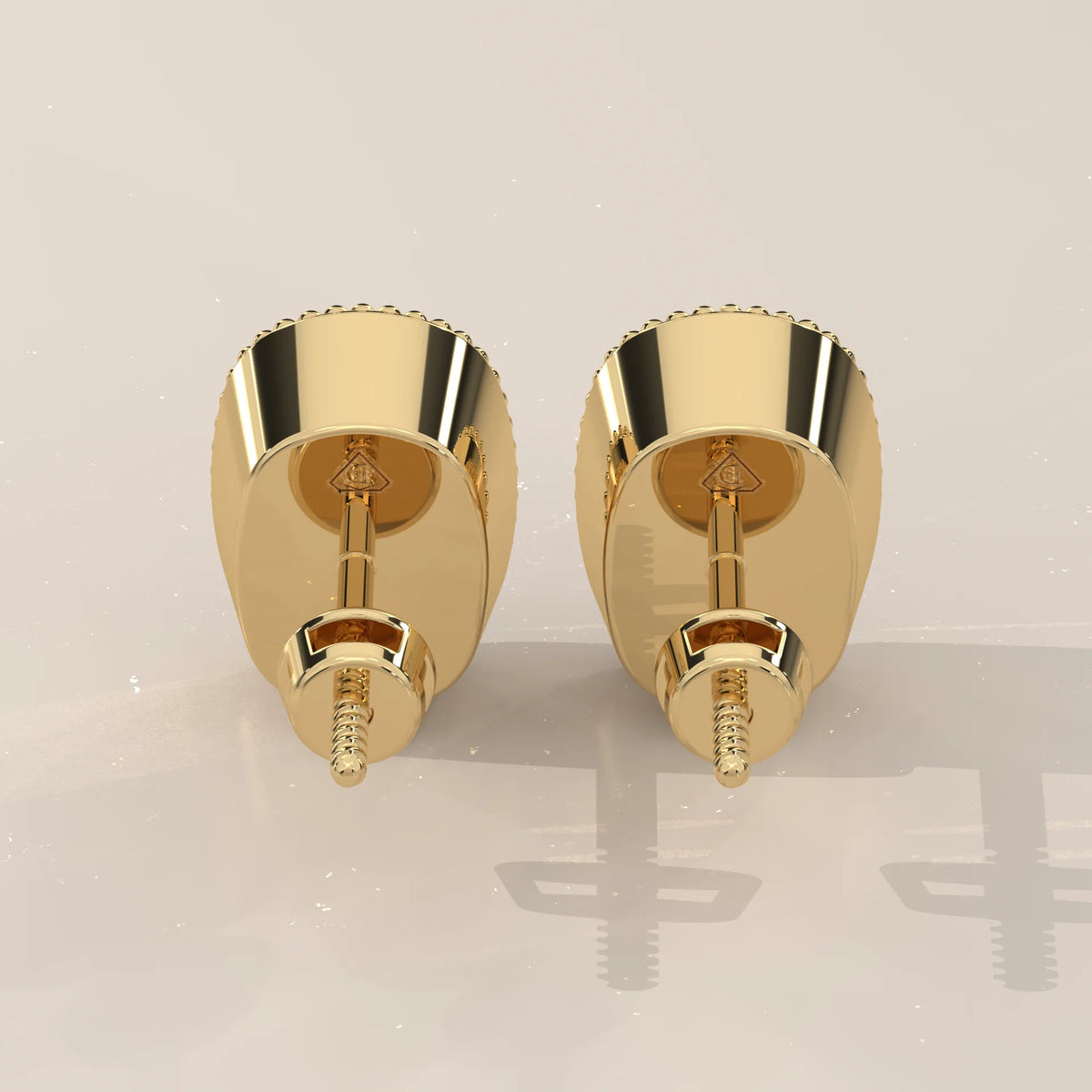 Elongated Cushion Lab Grown Diamond Studs in a Milgrain Bezel in yellow gold, shown from the side.