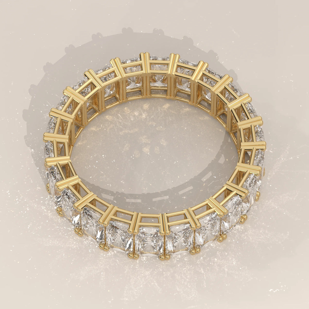Elongated Radiant Cut Diamond Eternity Band Set East West in yellow gold, product photograph on a plain background.