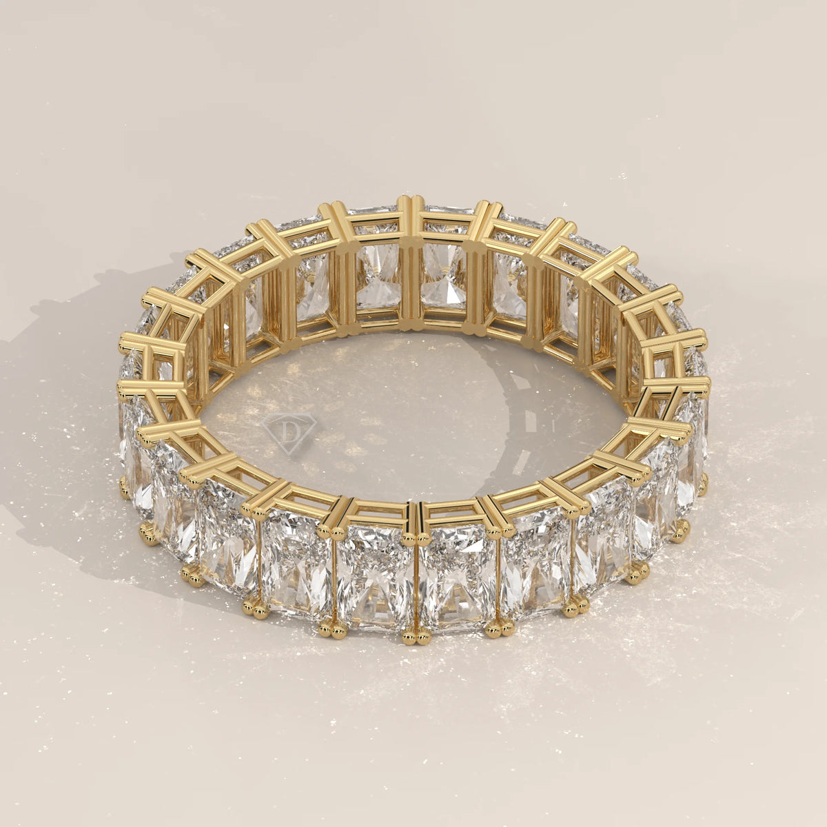 Elongated Radiant Cut Diamond Eternity Band Set East West in yellow gold, shown at an angle.