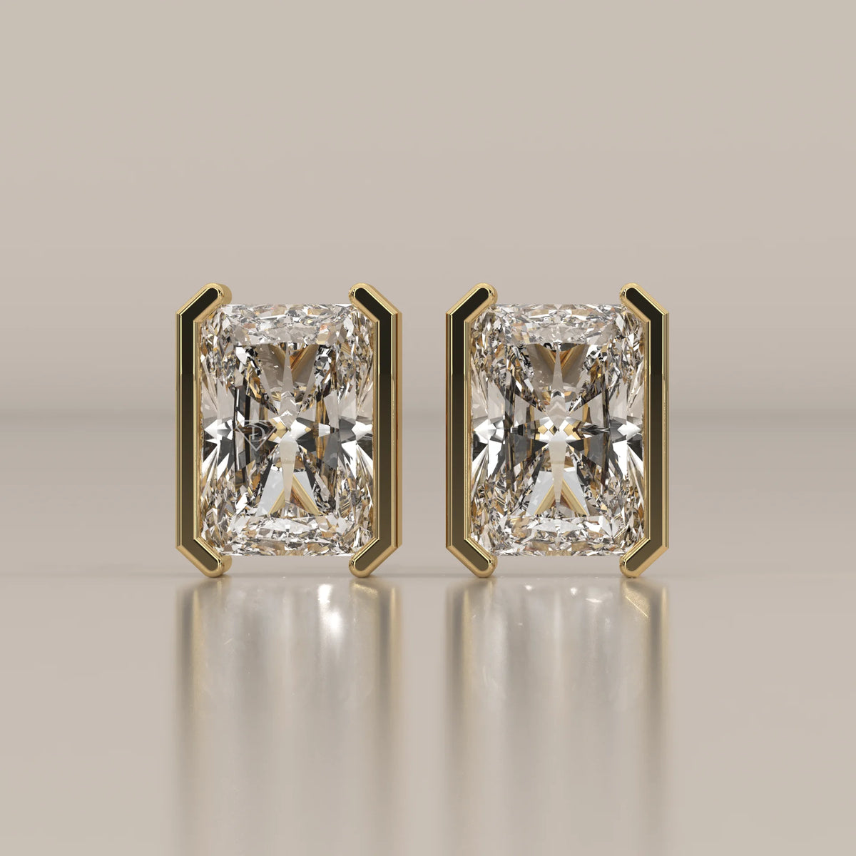 Elongated Radiant Half Bezel Lab Grown Diamond Stud Earrings in yellow gold, shown from the front.