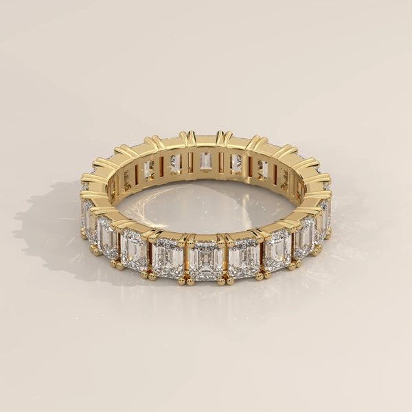 Three-Quarter View: Emerald Cut Diamond Eternity Band with Eternity Setting in Yellow Gold – Lab Grown – Driona Jewels