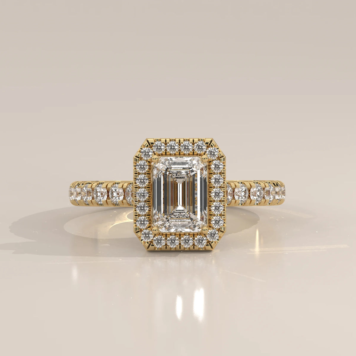 Emerald Cut Lab Grown Diamond Halo Ring with Pave Shank in yellow gold, photographed head-on.