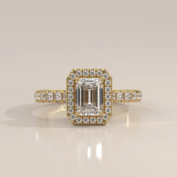 Emerald Cut Lab Grown Diamond Halo Ring with Pave Shank in yellow gold, photographed head-on.