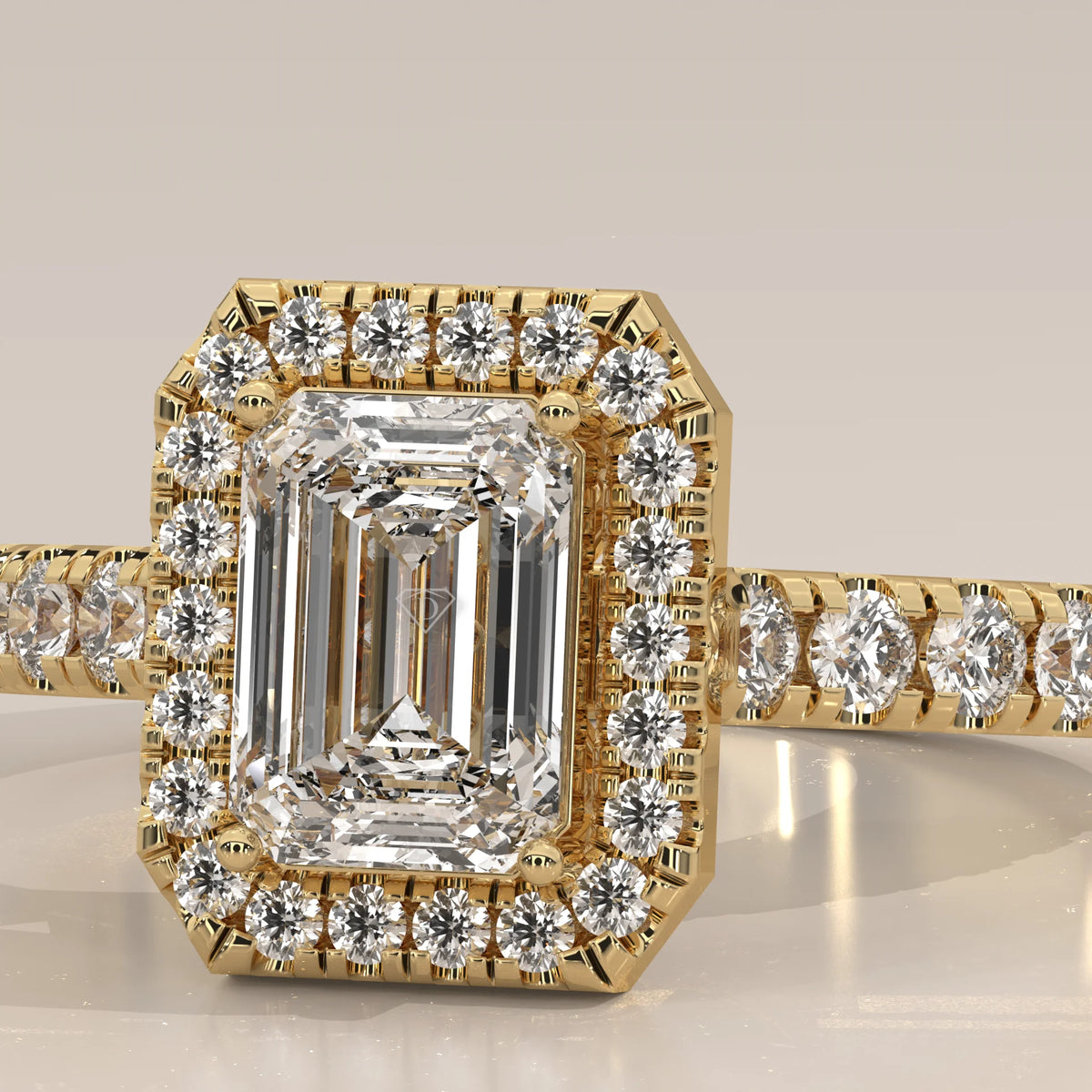 Emerald Cut Lab Grown Diamond Halo Ring with Pave Shank in yellow gold, front view on a plain background.