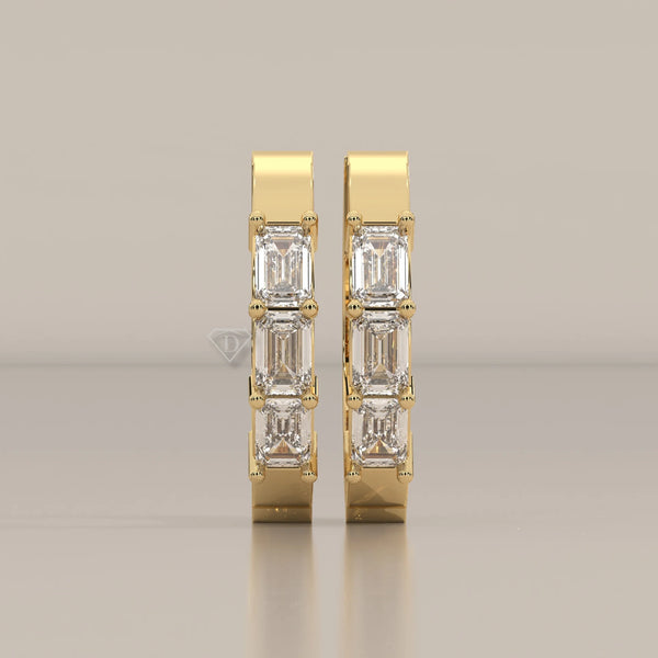 Front View: Emerald Cut Diamond Huggie Hoop Earrings with Prong Setting in Yellow Gold – Lab Grown – Driona Jewels