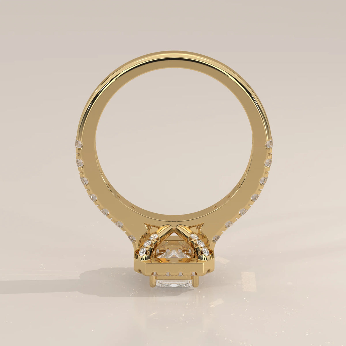 Emerald Cut Lab Grown Diamond Halo Ring with Pave Shank in yellow gold, shown on a plain background.