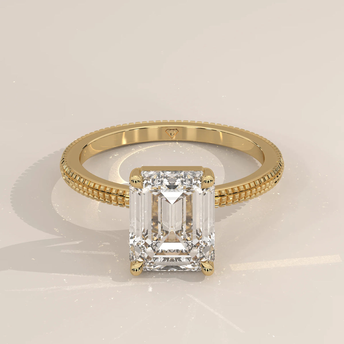 Yellow gold ring with an emerald-cut diamond and pave band.