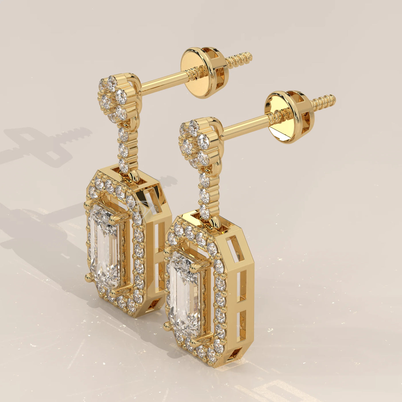 Three-Quarter View: Emerald Cut Diamond Dangle Earrings with Halo Setting in Yellow Gold – Lab Grown – Driona Jewels