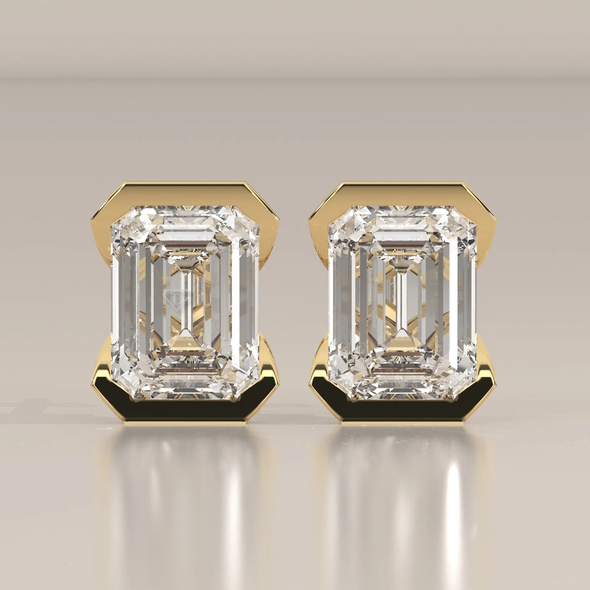 Emerald Cut Partial Bezel Lab Grown Diamond Stud Earrings in yellow gold, shown from the front.