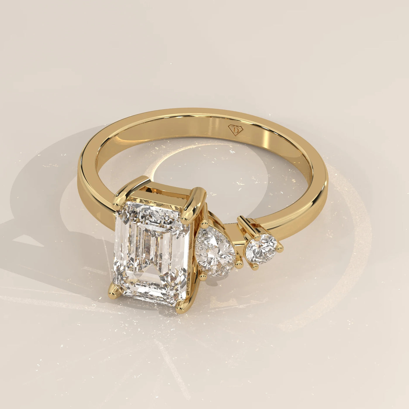 Angle View: Emerald Cut Diamond Ring with Three-Stone Setting in Yellow Gold – Lab Grown – Driona Jewels