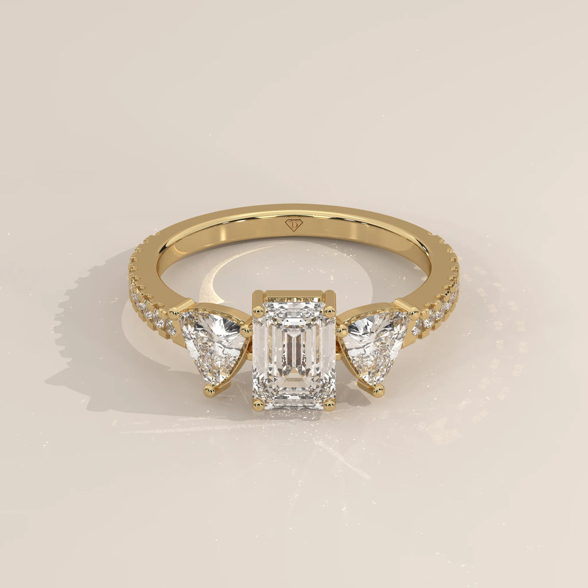 Three-Quarter View: Emerald Cut Diamond Ring with Three-Stone Setting in Yellow Gold – Lab Grown – Driona Jewels