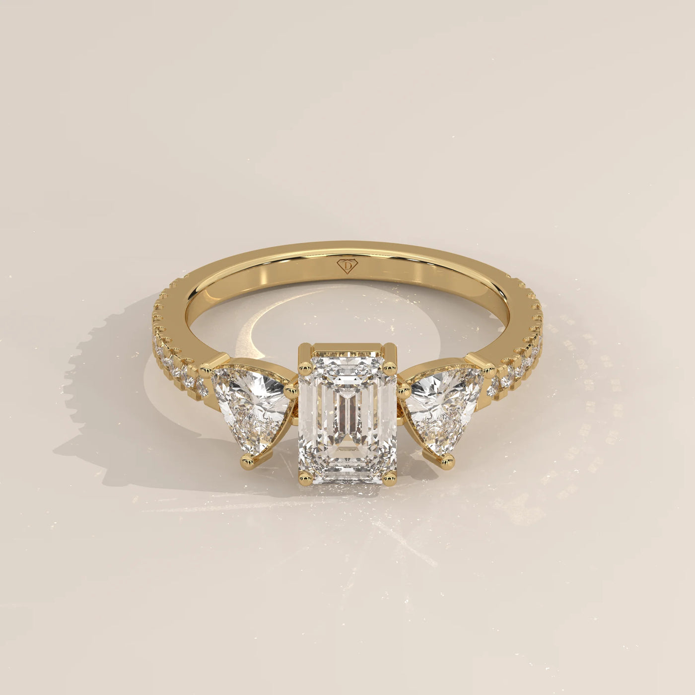 Three-Quarter View: Emerald Cut Diamond Ring with Three-Stone Setting in Yellow Gold – Lab Grown – Driona Jewels