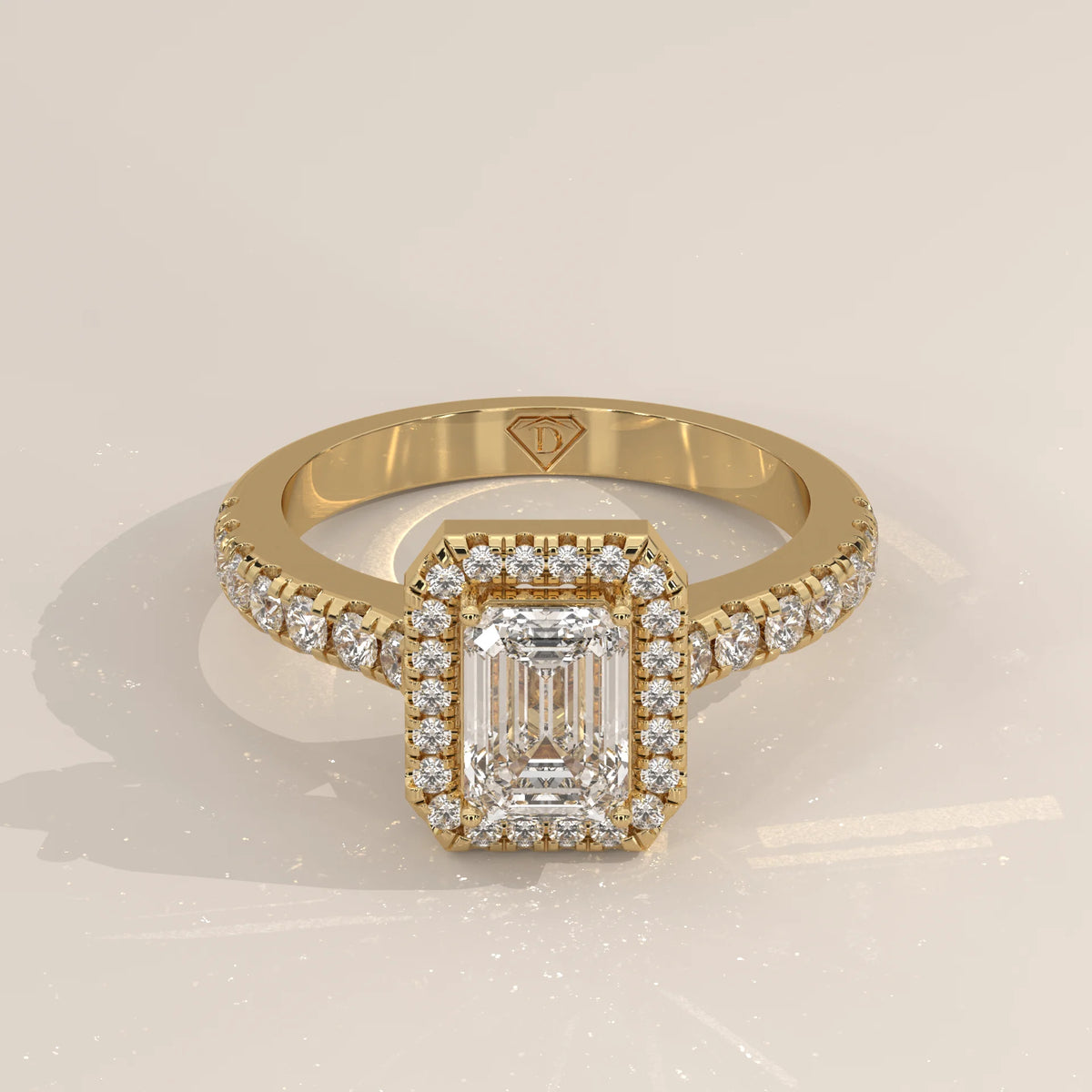 Emerald Cut Lab Grown Diamond Halo Ring with Pave Shank in yellow gold, shown from the front.