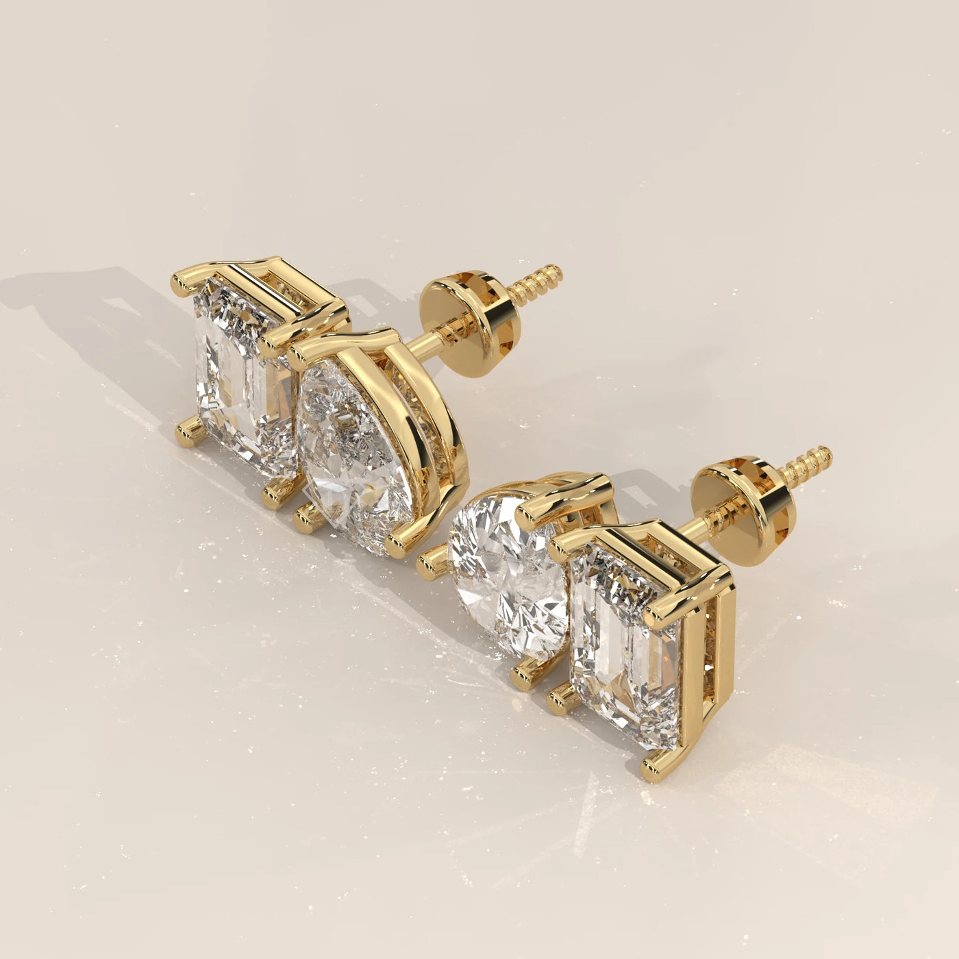 Three-Quarter View: Emerald Cut Diamond Stud Earrings with Prong Setting in Yellow Gold – Lab Grown – Driona Jewels