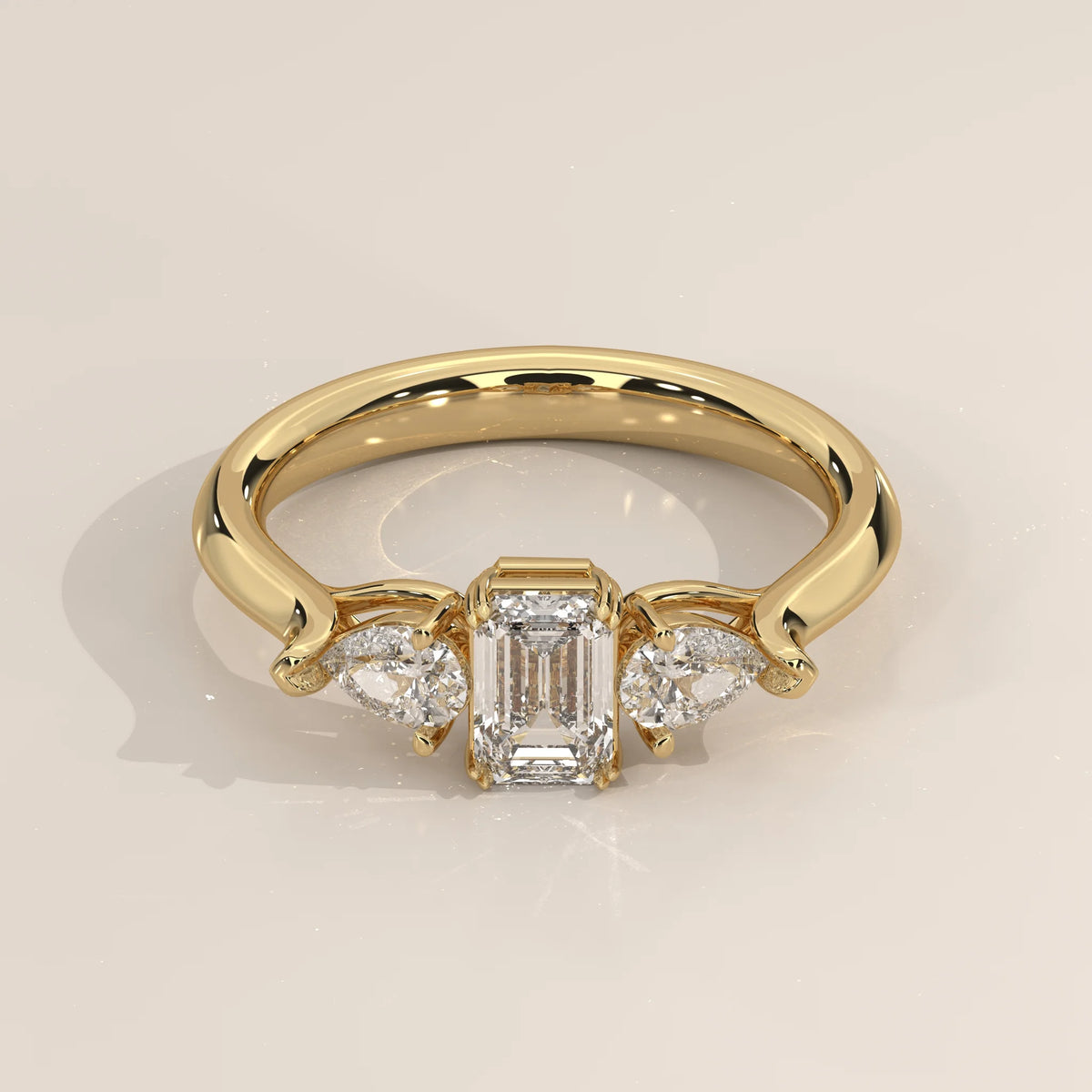 Three-Quarter View: Emerald Cut Diamond Ring with Three-Stone Setting in Yellow Gold – Lab Grown – Driona Jewels