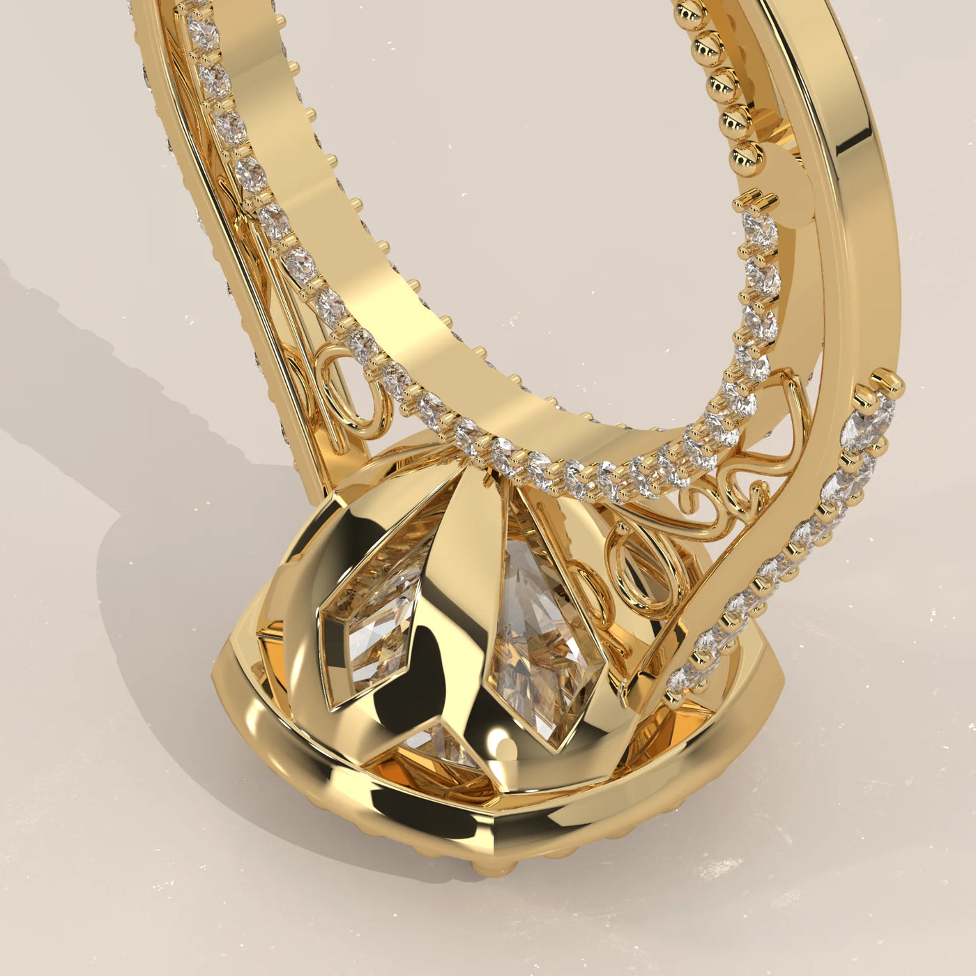 A close-up view of a yellow gold engagement ring with diamonds set into the band and a large central stone.
