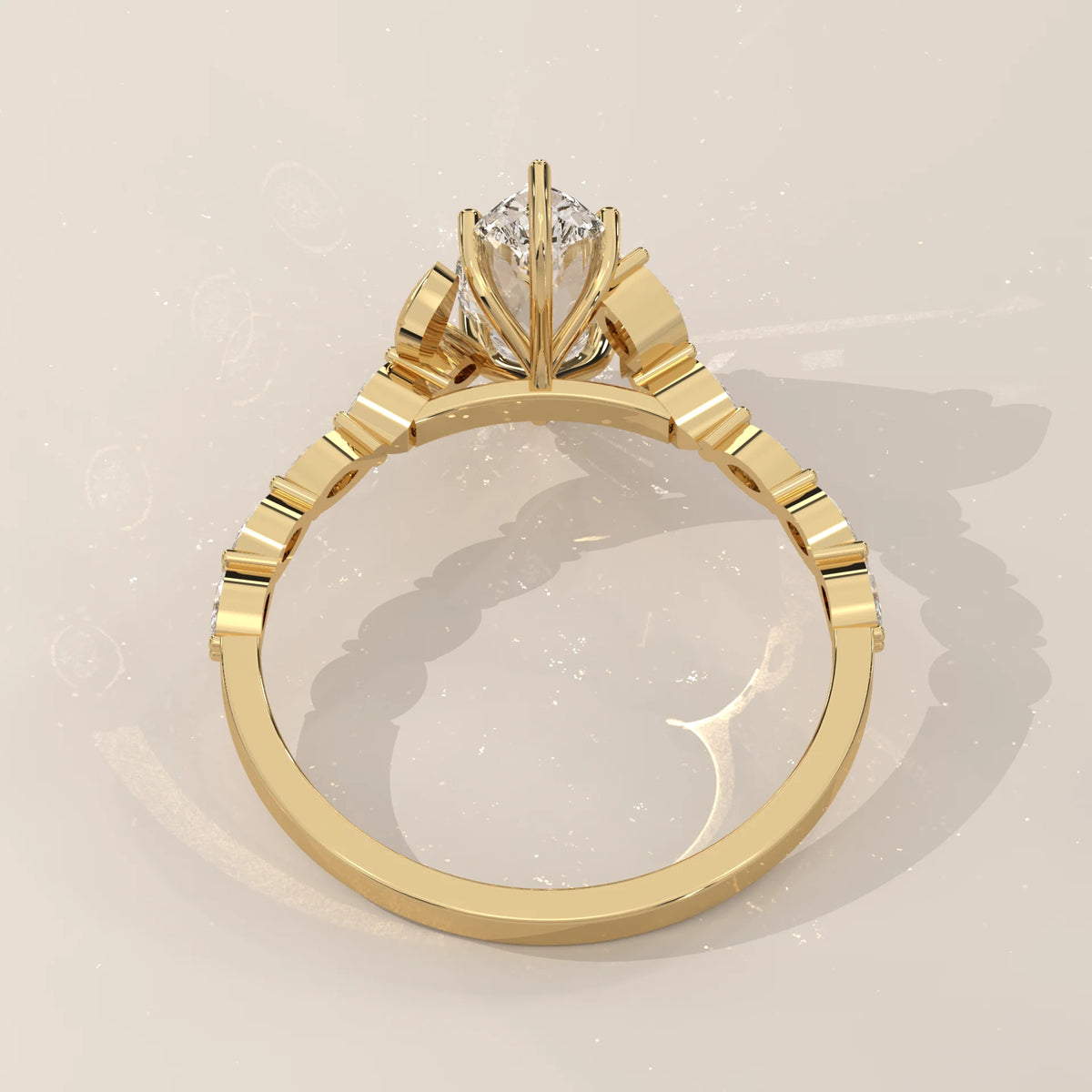 Yellow gold engagement ring with a marquise diamond and accent stones.
