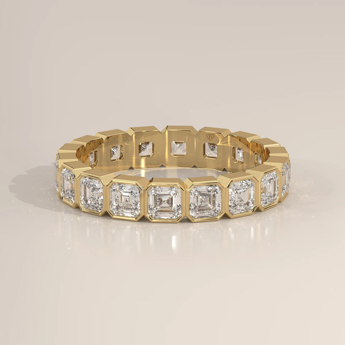 Square Emerald Cut Lab Grown Diamond Bezel Set Eternity Band in yellow gold, photographed head-on.