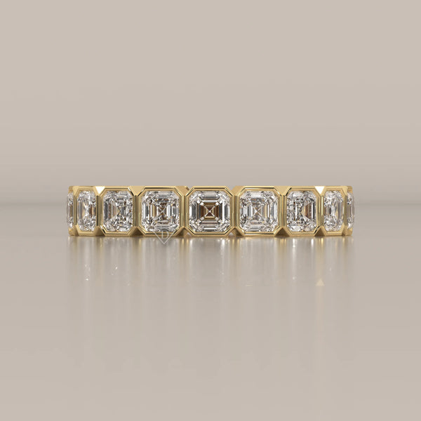 Square Emerald Cut Lab Grown Diamond Bezel Set Eternity Band in yellow gold, shown from the front.