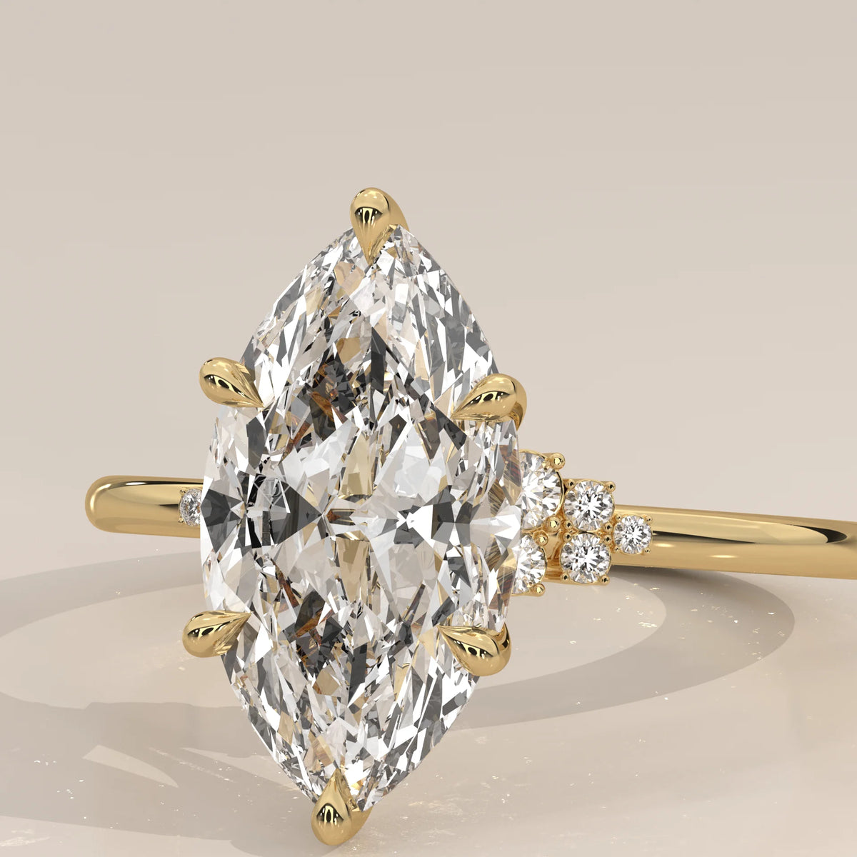 Fadie 5 Carat Marquise Lab Grown Diamond Ring, Cluster Shoulders in yellow gold, front view on a plain background.