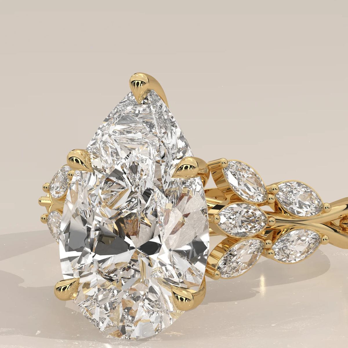 Fiana 5 Carat Pear Lab Grown Diamond Ring, Marquise Vine Band in yellow gold, product photograph on a plain background.