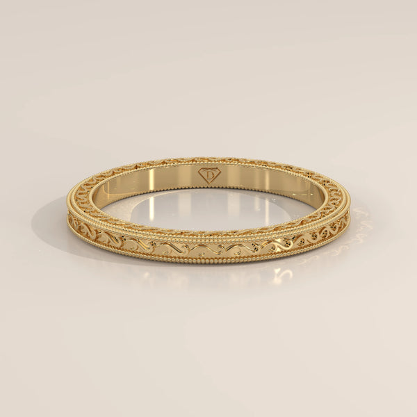 Fine Vine Engraved Slim Gold Band with Beaded Milgrain, shown at an angle.