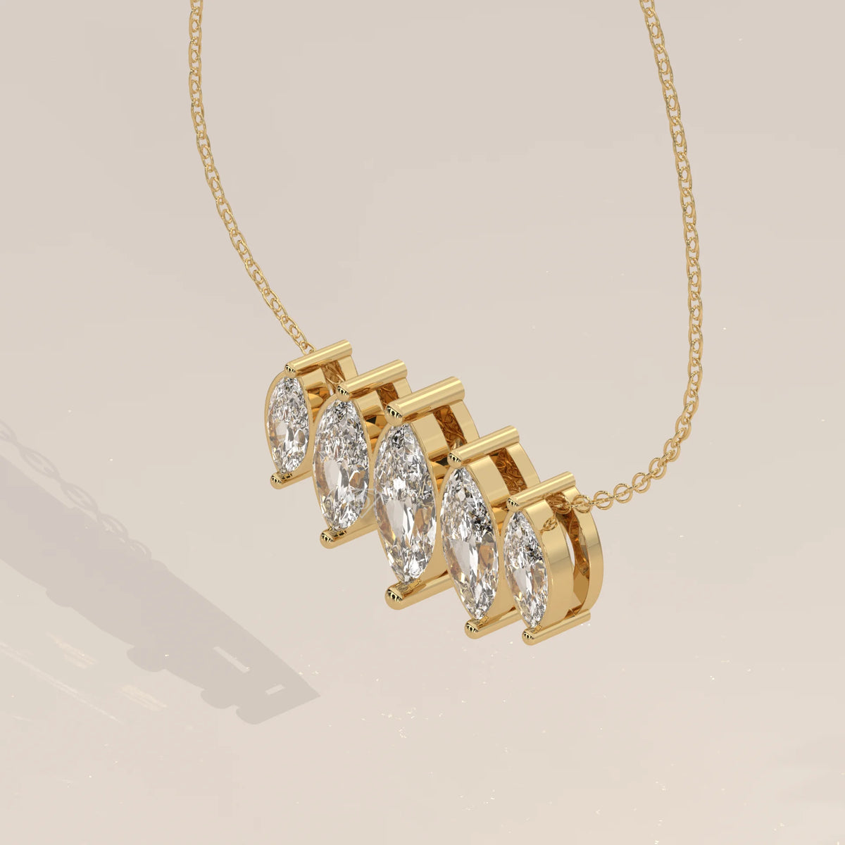 Five Graduated Marquise Lab Grown Diamond Bar Pendant in yellow gold, shown on a plain background.