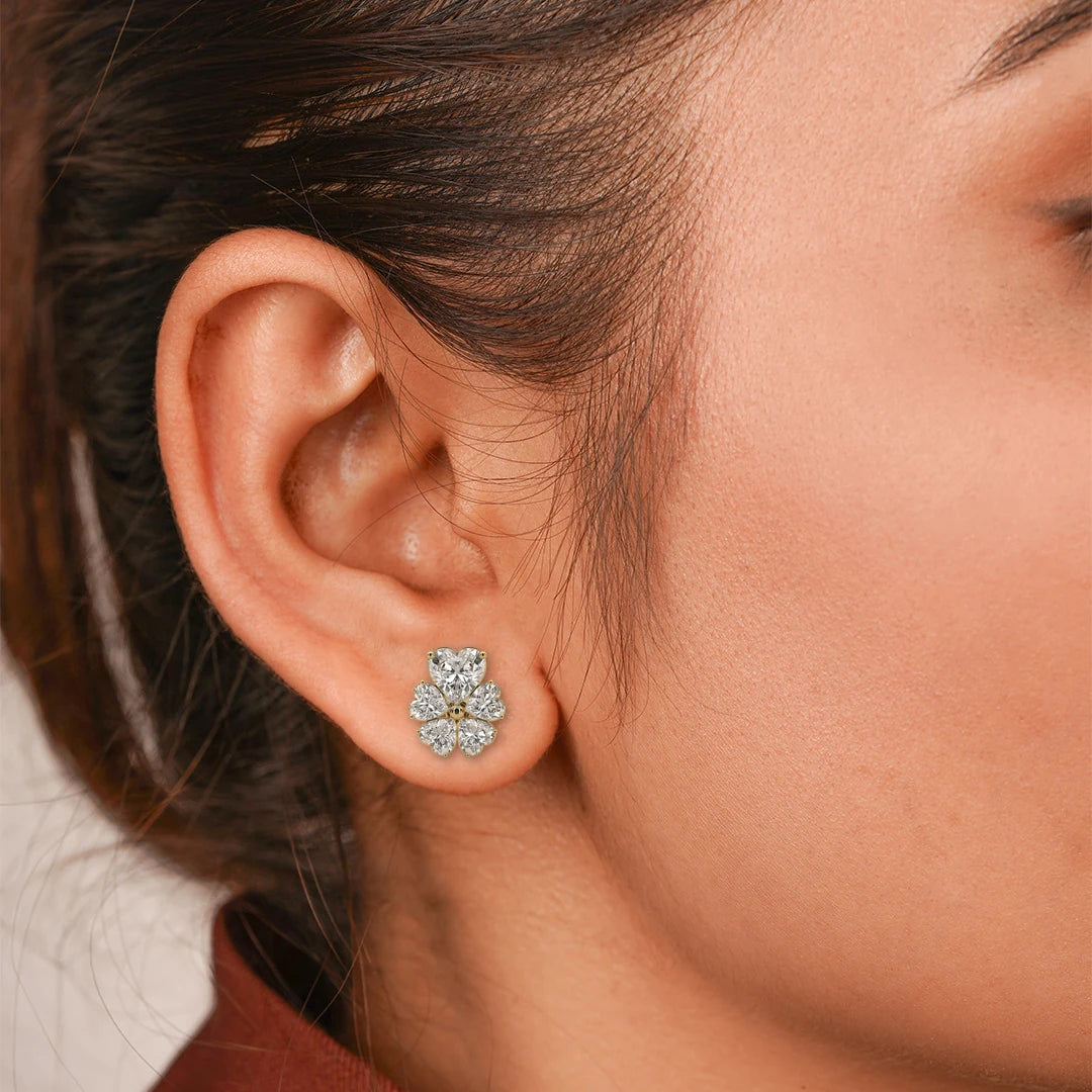 Five Heart Lab Grown Diamond Flower Stud Earrings with Gold Bead in yellow gold, worn on the model.