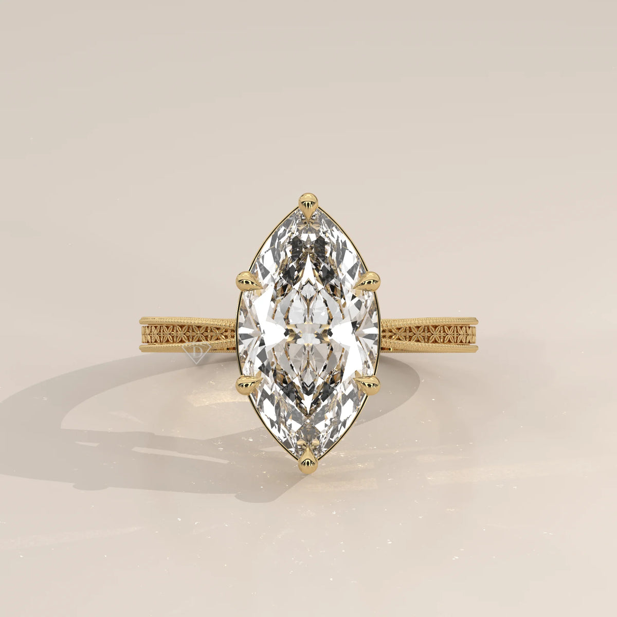 Ginnie 5 Carat Marquise Lab Grown Diamond Ring, Engraved Floral Band in yellow gold, photographed head-on.