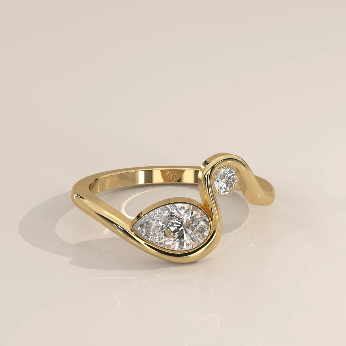Pear Lab Grown Diamond Swirl Ring with Bezel Set Round Accent in yellow gold, shown from the front.
