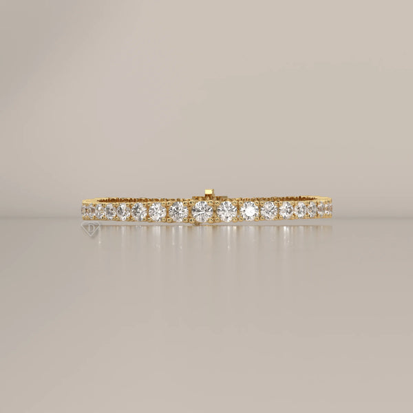Graduated Round Lab Grown Diamond Tennis Bracelet, Four Prong in yellow gold, photographed head-on.