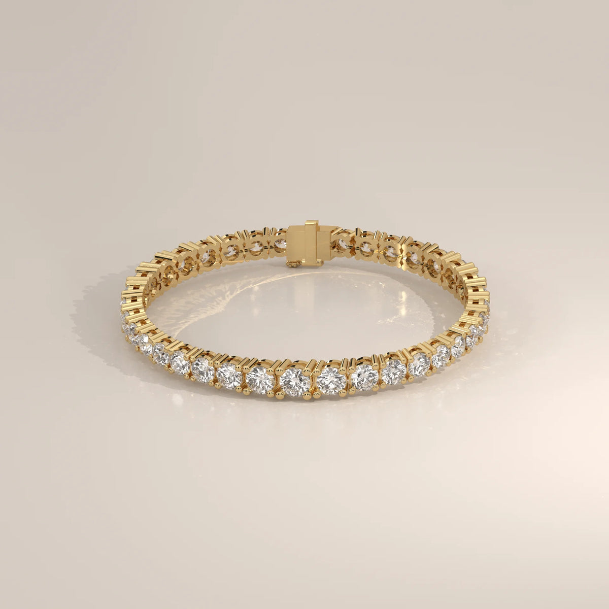 Graduated Round Lab Grown Diamond Tennis Bracelet, Four Prong in yellow gold, shown from the front.