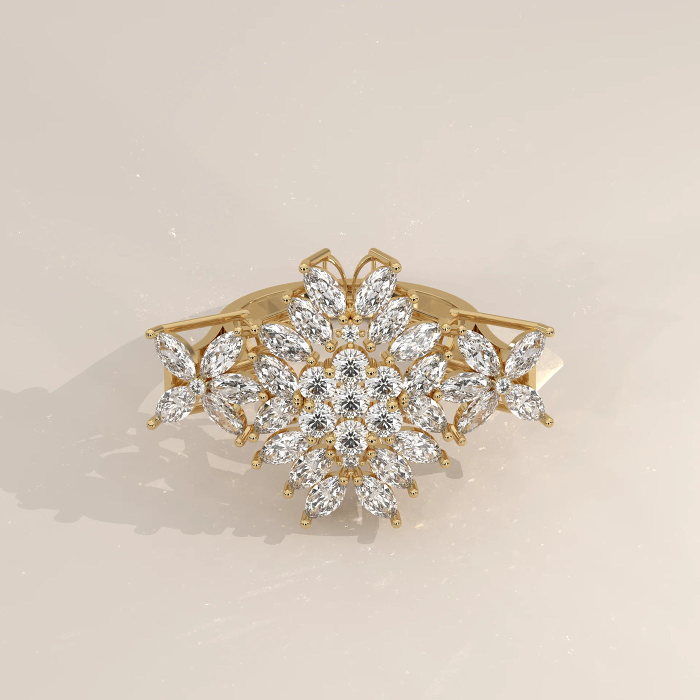 A gold hair clip adorned with clear, sparkling stones in a floral design.