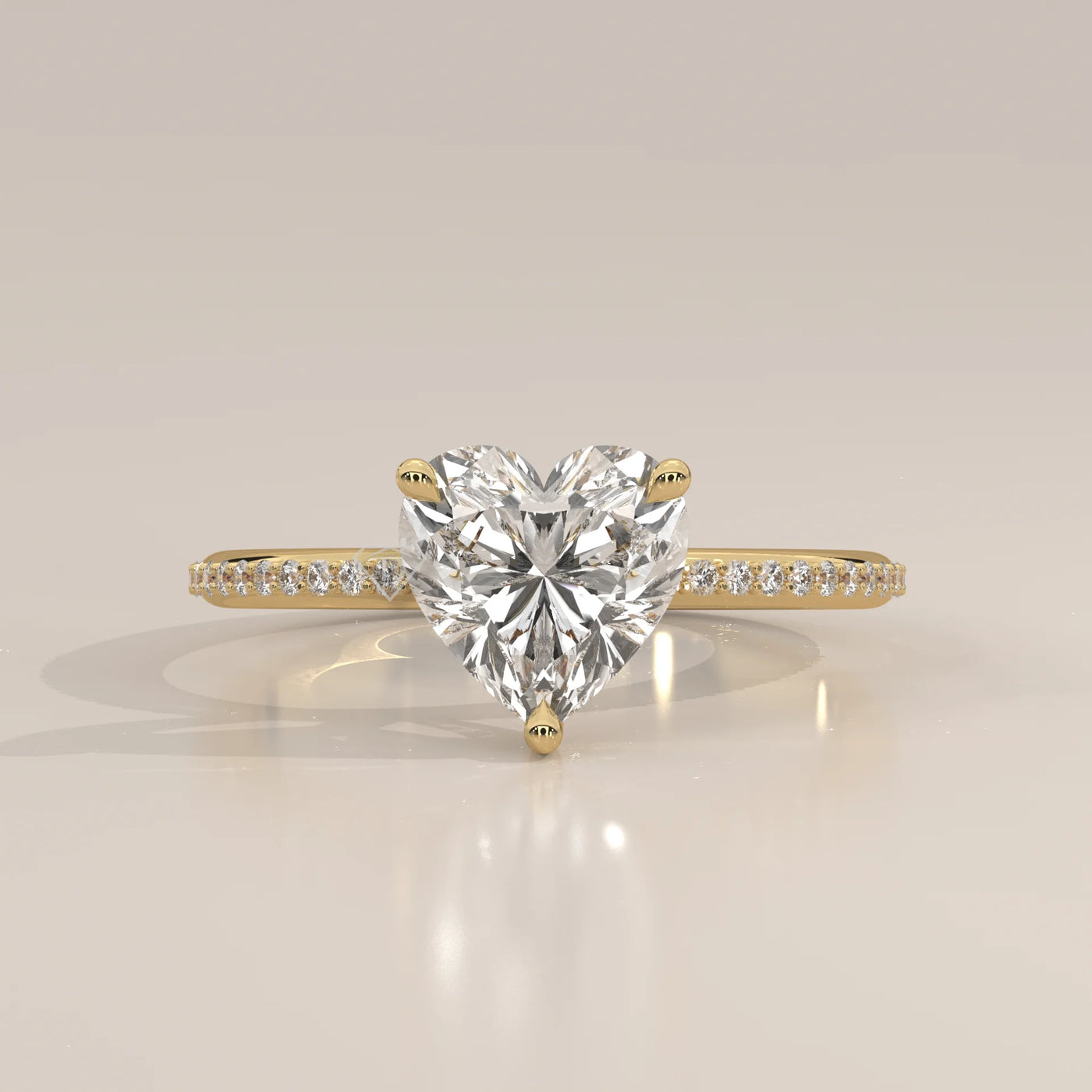 A beautiful 14k gold ring with a heart-shaped diamond and pave band.