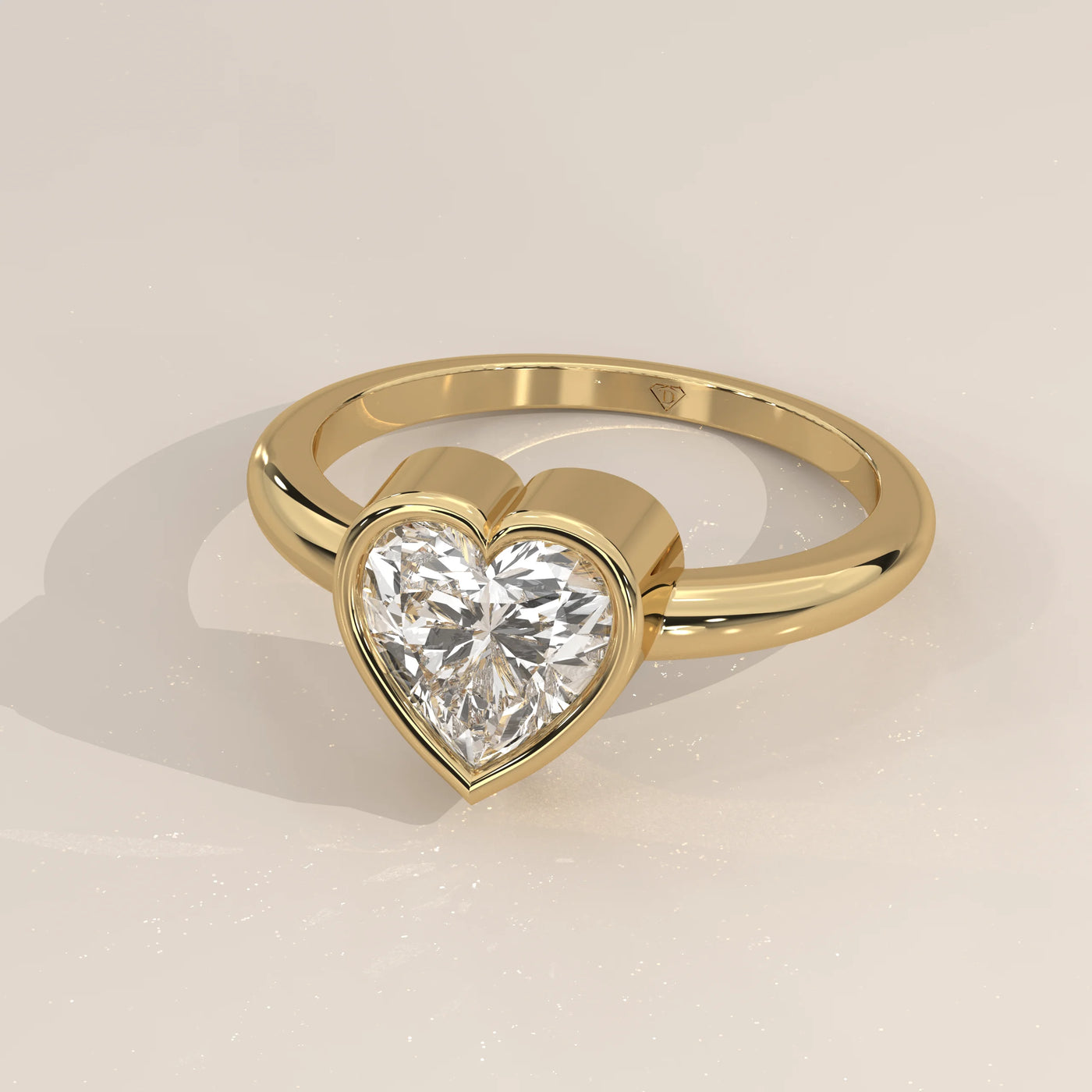 A beautiful 14k gold ring with a heart-shaped diamond and pave band.