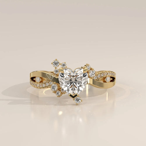 Gold ring with a heart-shaped diamond and smaller accent diamonds.