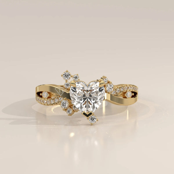 Gold ring with a heart-shaped diamond and smaller accent diamonds.