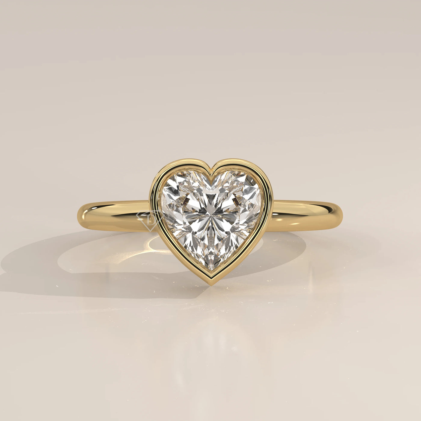 A beautiful 14k gold ring with a heart-shaped diamond and pave band.